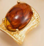 Vintage ring with an exaggerated geometric design and faux gemstone inlays.