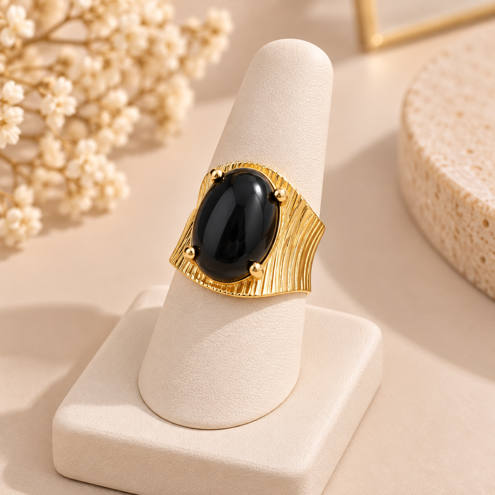 Vintage ring with an exaggerated geometric design and faux gemstone inlays.