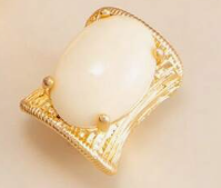 Vintage ring with an exaggerated geometric design and faux gemstone inlays.