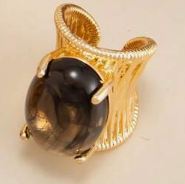 Vintage ring with an exaggerated geometric design and faux gemstone inlays.