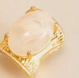 Vintage ring with an exaggerated geometric design and faux gemstone inlays.
